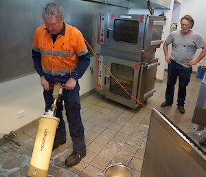 Expeditioners cleaning the floors of the kitchen