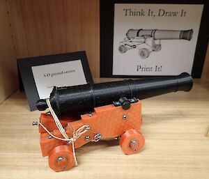 A plastic, 3D printed cannon on display during an arts and crafts exhibition on station