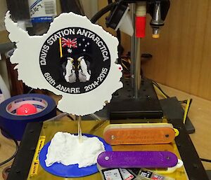 A 3D printer and its produce including an SD card holder and model of Antarctica