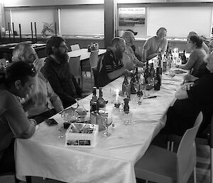 Expeditioners seated at a dinner table