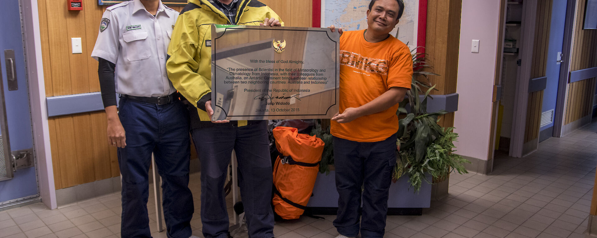 Indonesian delegations handing over a plaque to the Davis Station Leader