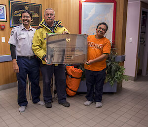 Indonesian delegations handing over a plaque to the Davis Station Leader