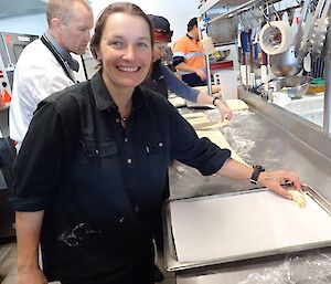A female expeditioner making a croissant