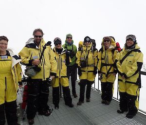 Six expeditioners in survival clothes posing for a photo before commencement of training