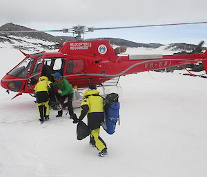 Expeditioners getting into a helicopter