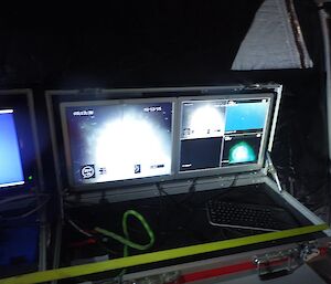 A number of computer screens with the images being sent back from the underwater vehicle