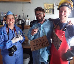 Three scientists in fancy dress at pre-dinner drinks