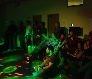 A group of expeditioners sitting and listening to the Davis Band