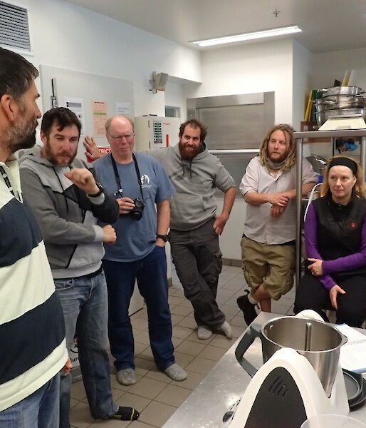 An expeditioner giving instruction on how to use a Thermomix