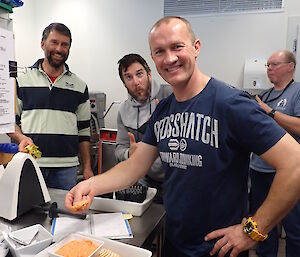 An expeditioner is tasting some food