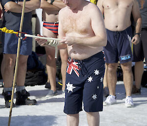 A expeditioner about to enter the water for his summer swim with a Go-Pro fitted to his head