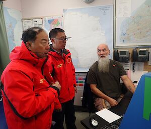 Two Chinese visitors shown the Davis communications consul by the Davis operator