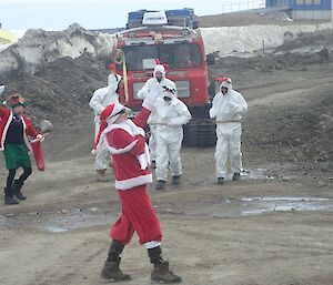 Expeditioners dressed as Santa, elves and reindeer.