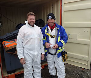 two expeditioners dressed in hazardous protection suits