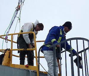 A safety harness for an expeditioner about to enter a large water tank