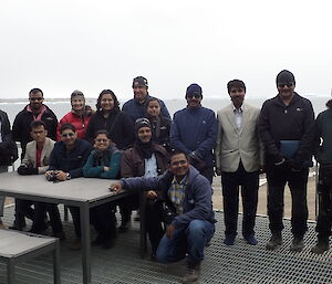 An Indian group of expeditioners pose for a photo with two Australian expeditioners