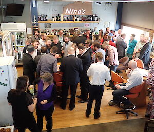 Expeditioners fill the Davis station bar — photo is taken from above the crowd