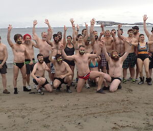 A group of expeditioners pose for a photo before the Australia day swim