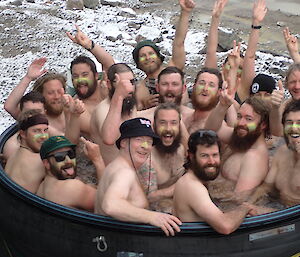 A group of expeditioners in an outdoor spa