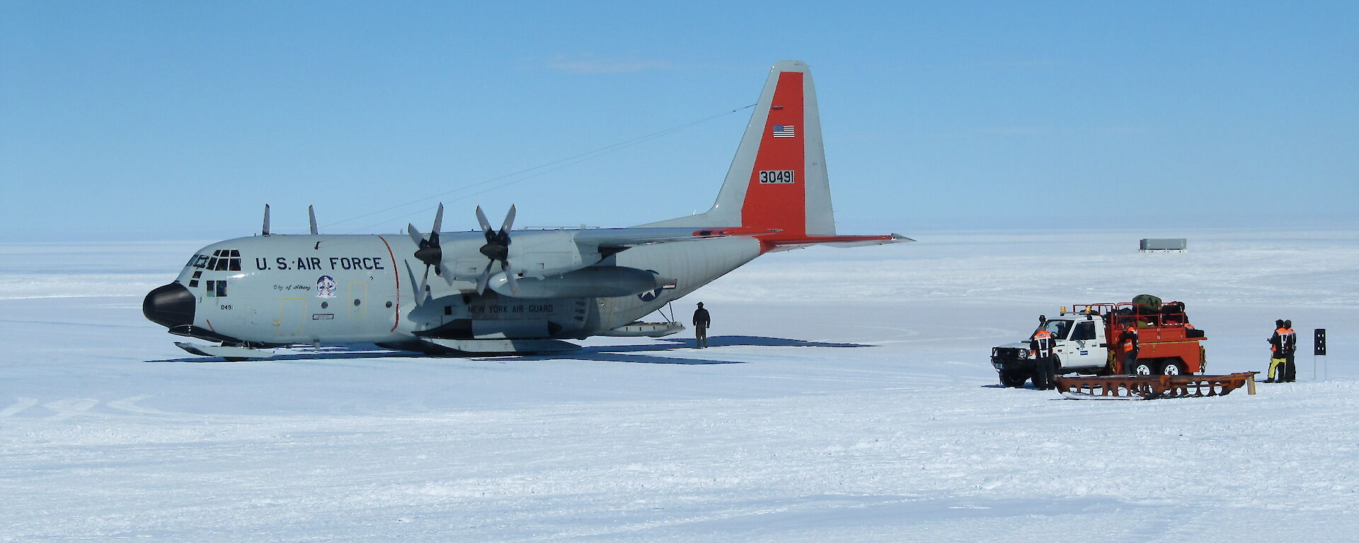A US C-130 at Wilkins runway ready to depart for Davis Station