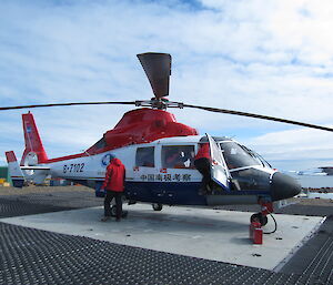 Dauphine helicopter on the helicopter pad at Davis after delivering several CHINARE expeditioners for a short visit