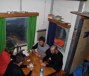 Davis expeditioners playing Uno in Brookes hut