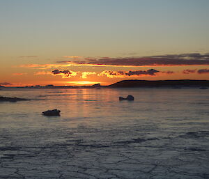 The sun’s glow reflected of the newly formed sea ice at Davis
