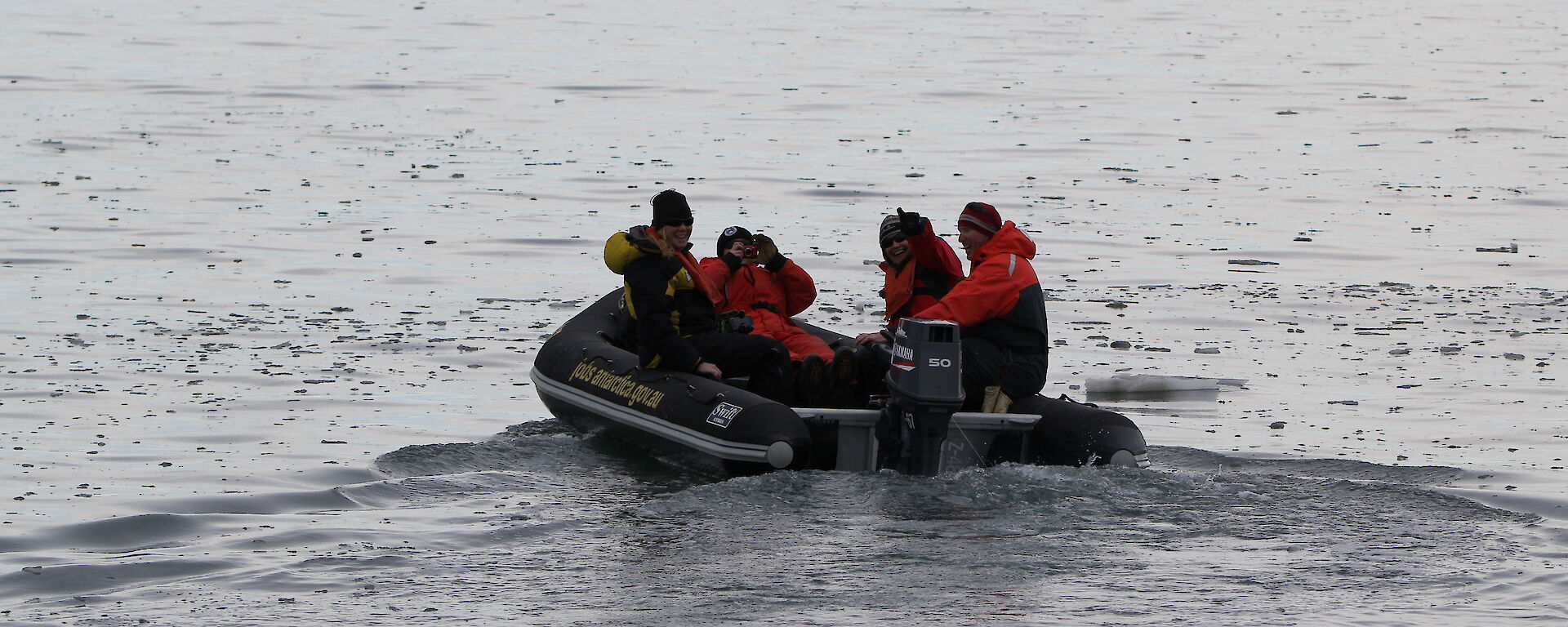 The beginning of sea ice formation at Davis 2016 — grease ice and brash ice in the bay in front oft the station on the 8th of March. An IRB in the water travelling out to the Chinese ship with passengers Jenn McGhee and Sharon Labudda.
