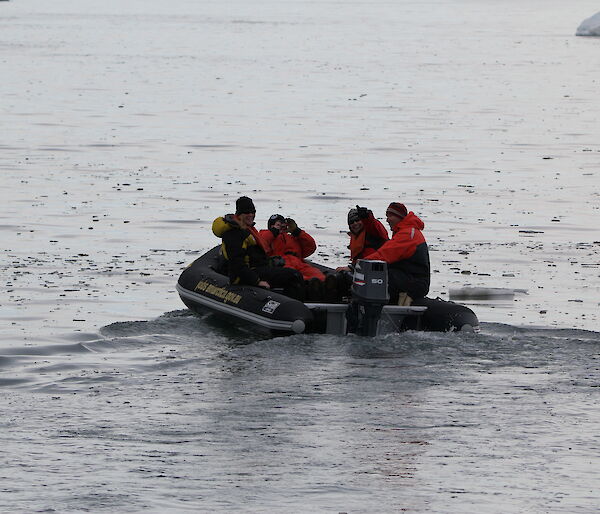 The beginning of sea ice formation at Davis 2016 — grease ice and brash ice in the bay in front oft the station on the 8th of March. An IRB in the water travelling out to the Chinese ship with passengers Jenn McGhee and Sharon Labudda.