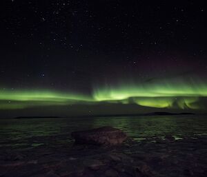 A view of the brilliant green glowing Aurora Australia in the sky above Davis recently