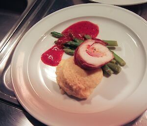 A plate of chicken involtini with soft polenta asparagus and capsicum glaze. One of the quality meals produce by Lesley Eccles for our formal Easter meal on Saturday night