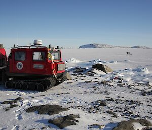 Hägglunds in foreground, on shore looking out at Ladge Kviz where Ali Dean and Chris Burns are drilling ice