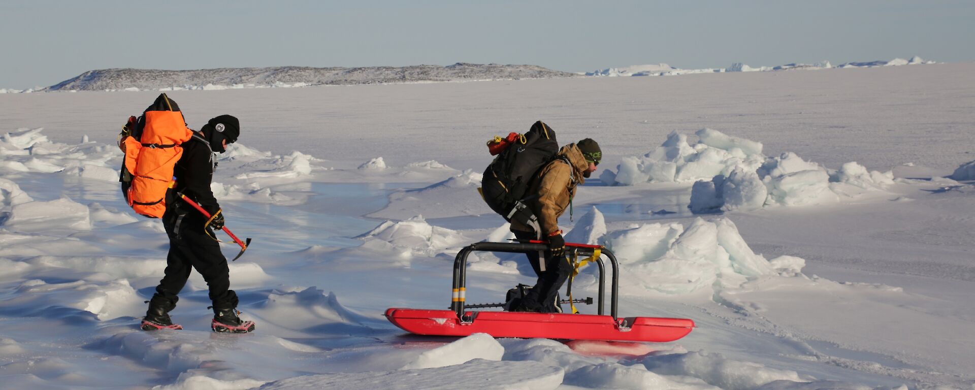 Ladge Kviz and Chris Burns cross the tidal zone at Davis using a float safety device