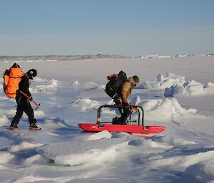 Ladge Kviz and Chris Burns cross the tidal zone at Davis using a float safety device