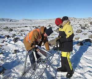 Dave Davies and John Parker connecting the power to the AWS instrumentation before erecting