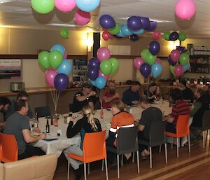 The dining room in the living quarters at Davis with table set and sixty helium-filled balloons as centre-pieces in celebration of Dave Davies 60th birthday