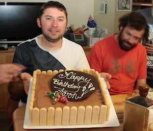 Aaron Stanley holds his ice-cream birthday cake