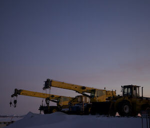 Winterised machinery lined up on the heli pad