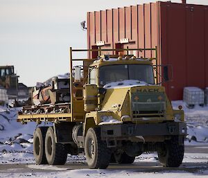 Mack truck loaded with small implements, parked at Davis for the winter