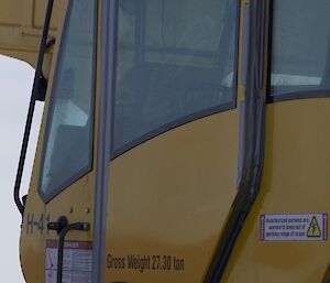 Crane with taped up doors to stop the driving snow in blizzards getting in