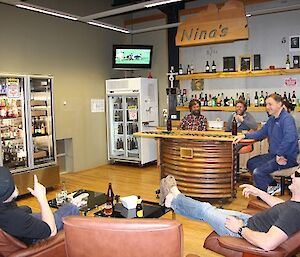 Group of men watching football game on TV