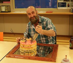 Darren white cutting his birthday cake at Davis