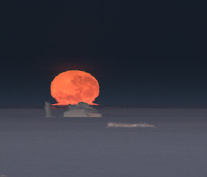 Moon setting over the frozen Prydz Bay