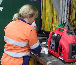 Ali Dean servicing one of the small portable generators