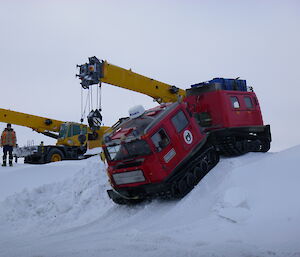 An around station driving track for Hägglunds driver training includes a steep decline near the helipads