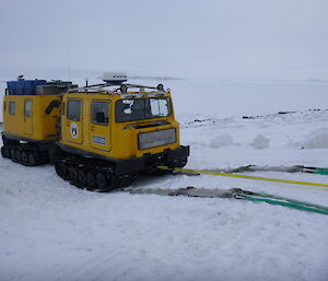 A yellow Hägglunds at Davis set up with the sea ice recovery system during training