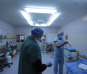 Dave Davies scrubbed and donning theatre attire with Paul Deverall watching for any breach of the sterile field during a LSA scenario at Davis