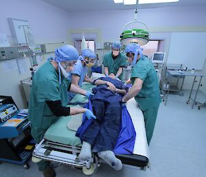 Vas Georgiou acts as patient during a surgical scenario to hone processes at Davis