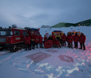 The sixteen expeditioners on the beach at Davis at an outside smoko to raise awareness about MS