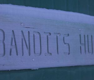 The carved Bandits hut sign on the outside of the hut